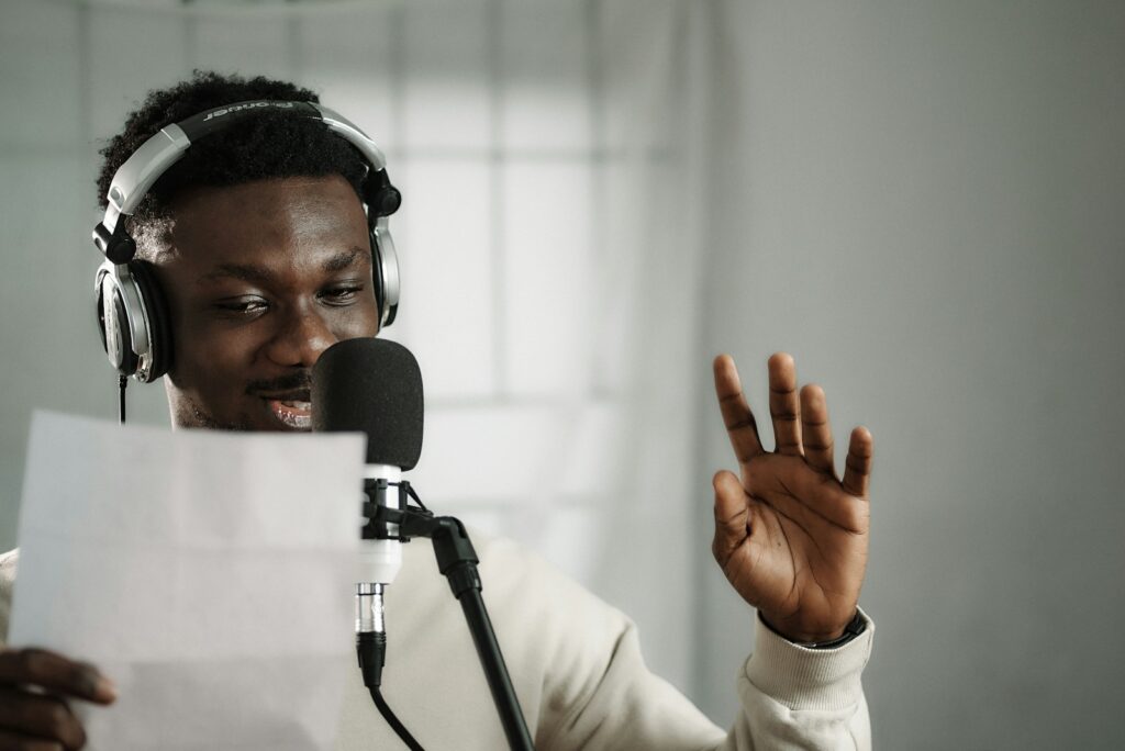 a man wearing headphones speaking languages
