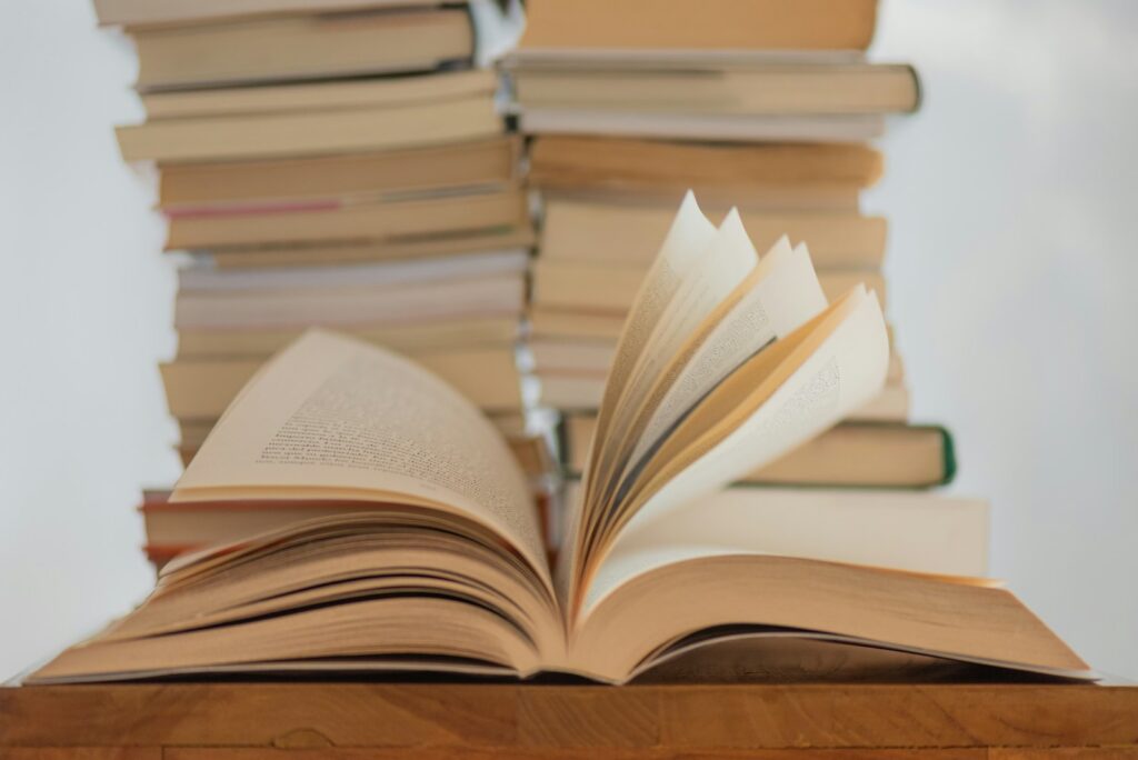 white book on brown wooden table novel and word count
